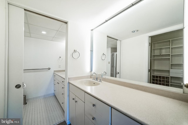 bathroom with tile patterned flooring and vanity