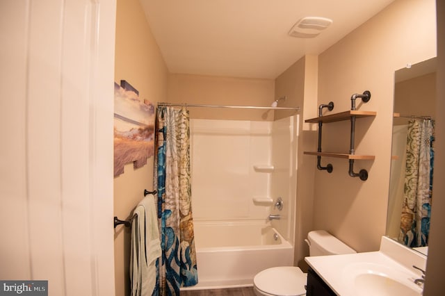 full bathroom with vanity, toilet, and shower / bath combo with shower curtain