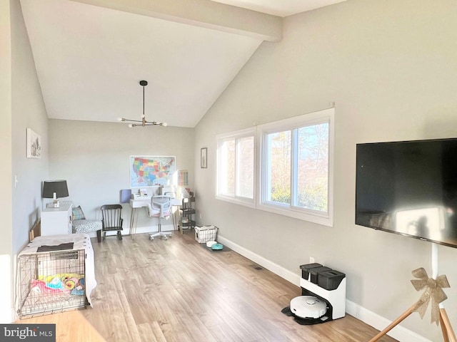 interior space with beamed ceiling, high vaulted ceiling, wood finished floors, an inviting chandelier, and baseboards