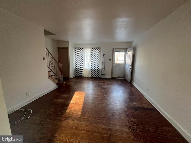 interior space with dark hardwood / wood-style flooring