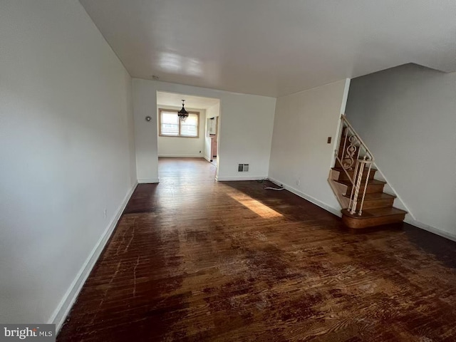 spare room featuring dark hardwood / wood-style floors