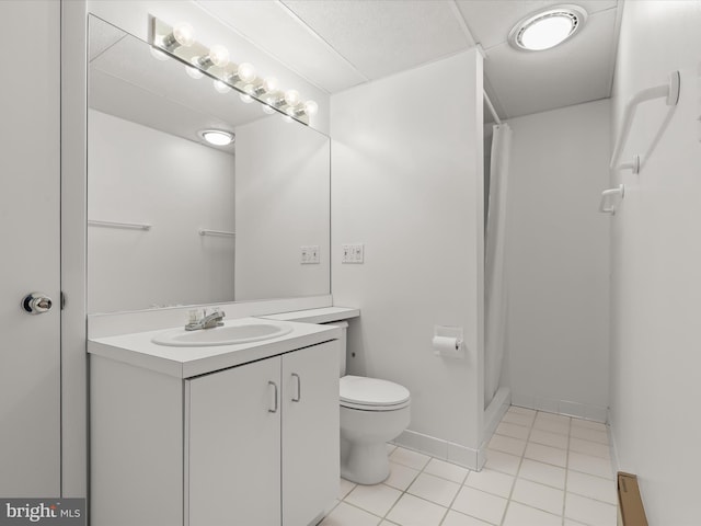 bathroom featuring tile patterned floors, toilet, curtained shower, and vanity