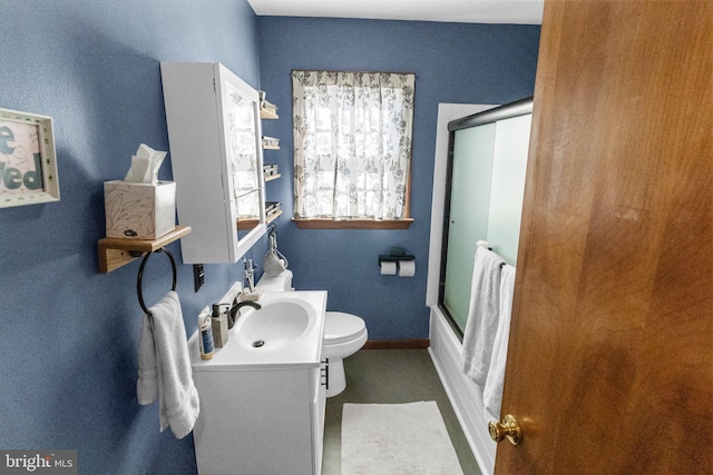 full bathroom featuring toilet, vanity, and bath / shower combo with glass door