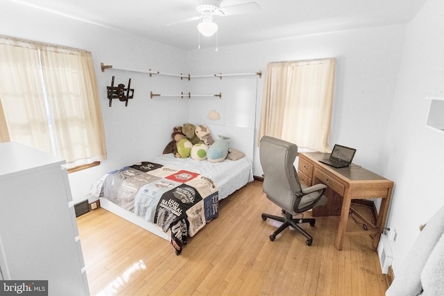 bedroom featuring ceiling fan and hardwood / wood-style floors