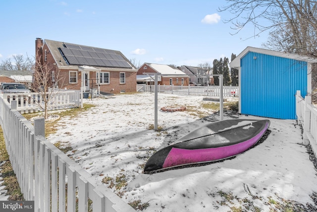 view of yard covered in snow