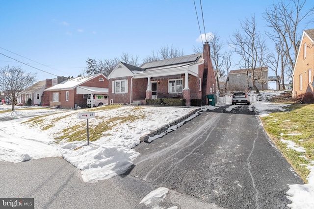 view of front of property featuring covered porch