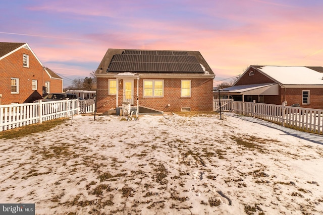 back house at dusk with solar panels