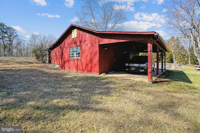 view of outbuilding with a carport