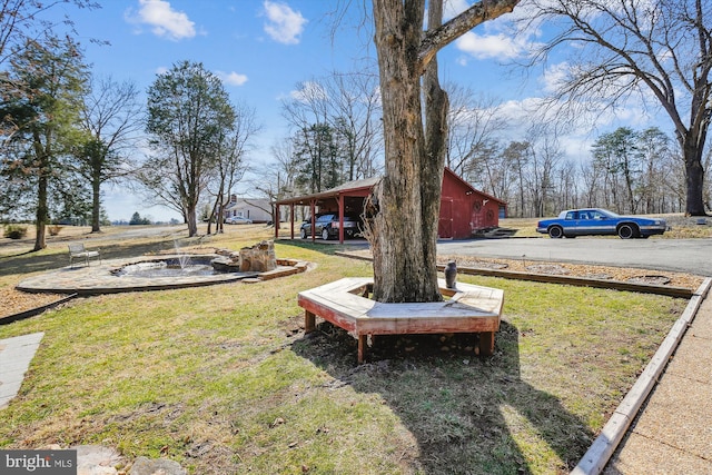 view of yard featuring an outbuilding and a barn