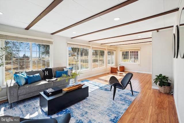 living area with recessed lighting, beam ceiling, baseboards, and hardwood / wood-style flooring