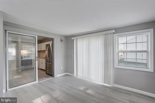 unfurnished room featuring light wood-type flooring