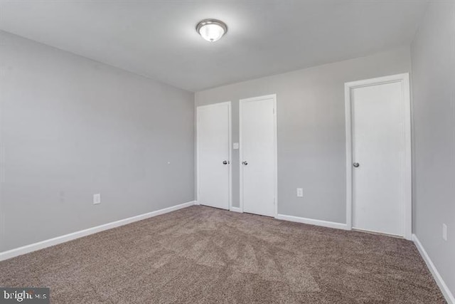 unfurnished bedroom with carpet flooring