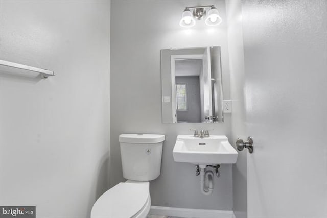 bathroom with toilet and sink