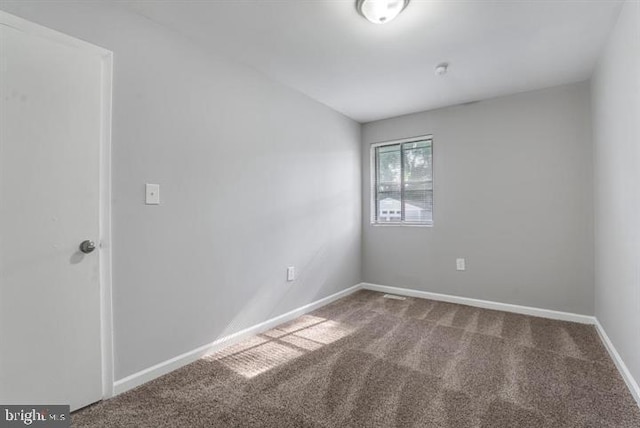 empty room featuring carpet floors