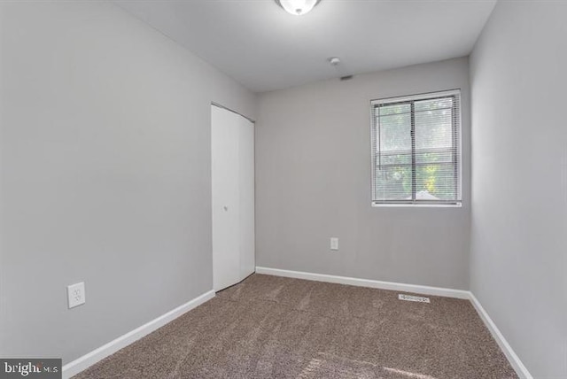 unfurnished room with carpet