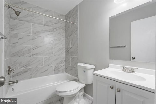 full bathroom featuring vanity, tiled shower / bath combo, and toilet