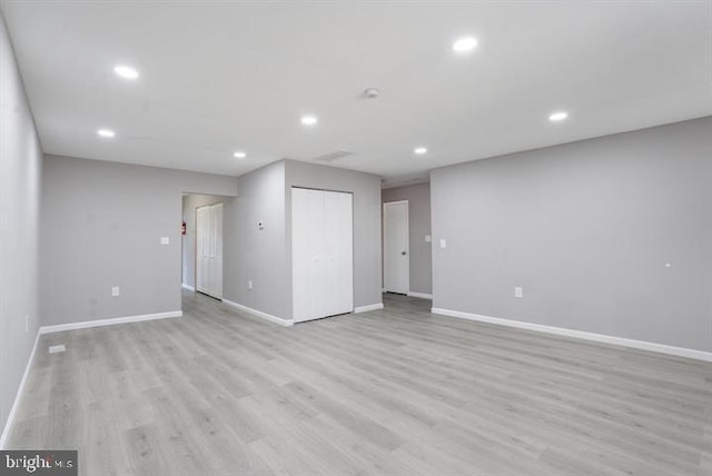 spare room with light hardwood / wood-style floors