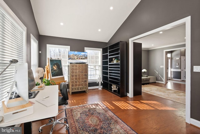 home office with wood-type flooring and lofted ceiling