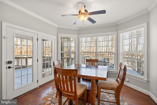 dining space with hardwood / wood-style flooring, ceiling fan, and ornamental molding