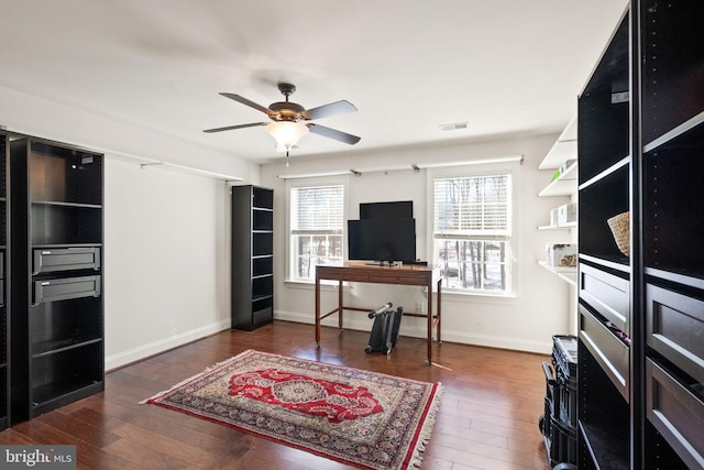 living room with ceiling fan and dark hardwood / wood-style floors