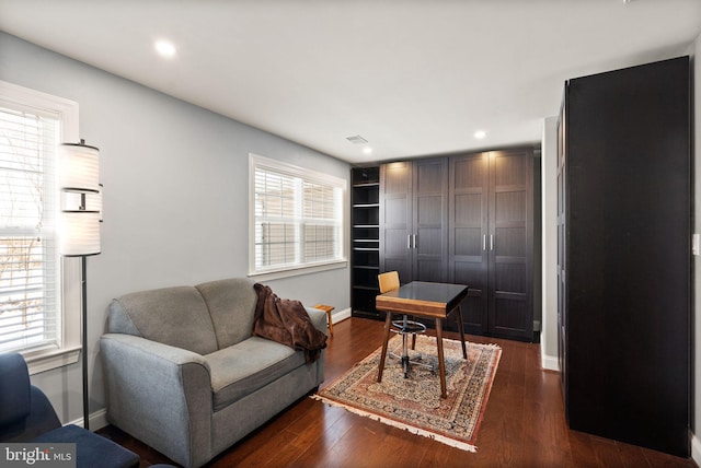 living room featuring dark wood-type flooring