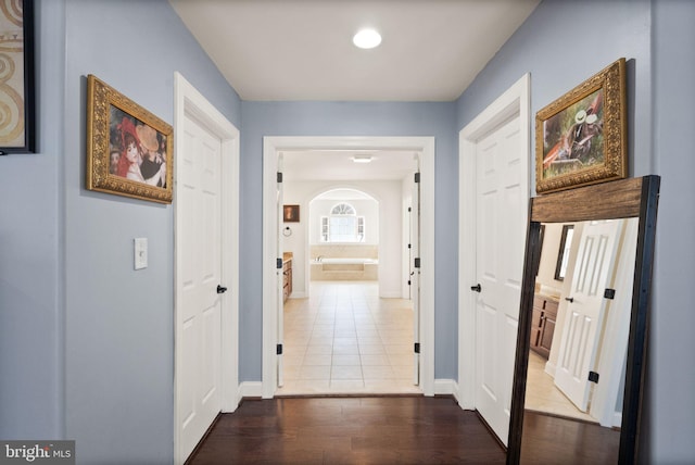 hallway featuring tile patterned floors