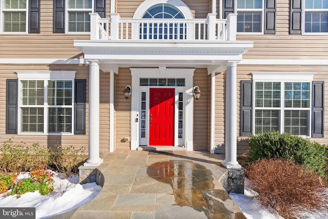 entrance to property featuring a balcony