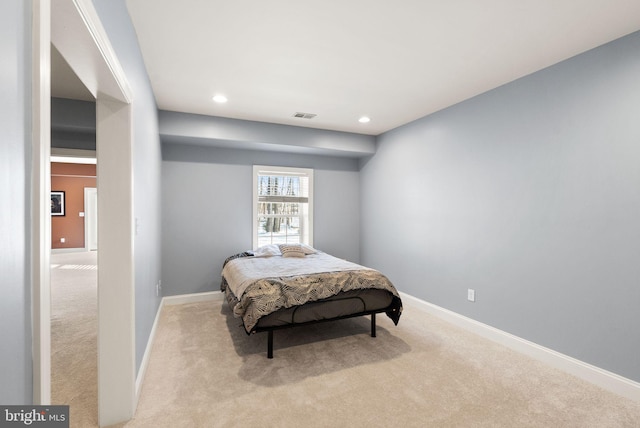 bedroom with light carpet