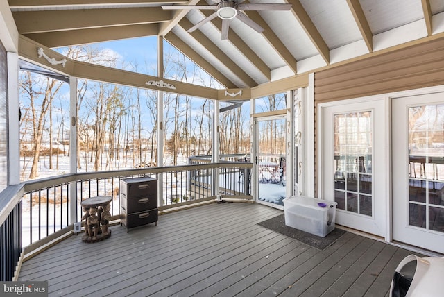 unfurnished sunroom featuring ceiling fan and lofted ceiling