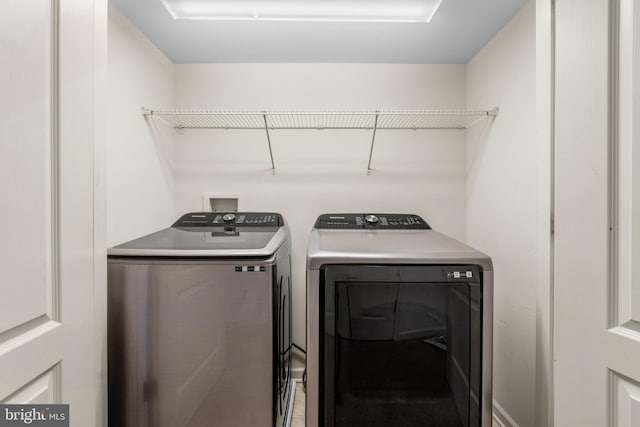 washroom featuring independent washer and dryer