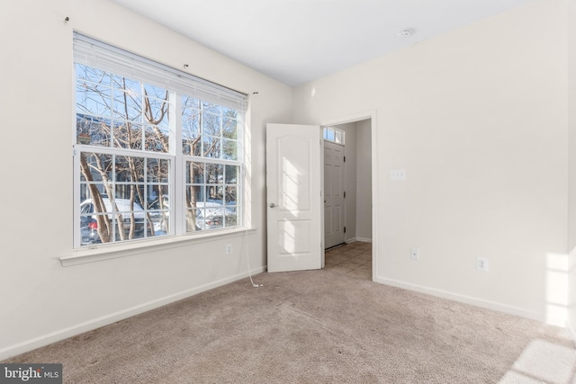 unfurnished bedroom featuring light colored carpet