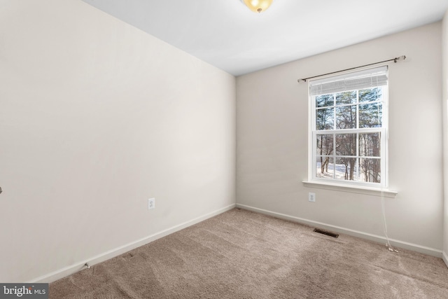 spare room featuring carpet flooring