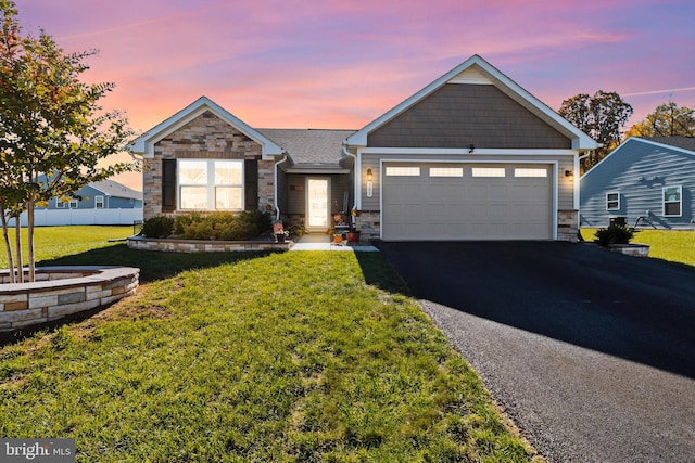 view of front facade featuring a yard and a garage