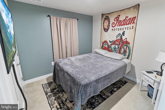 bedroom with light colored carpet