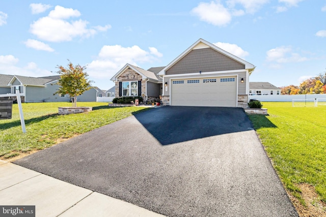 view of front facade with a garage and a front yard