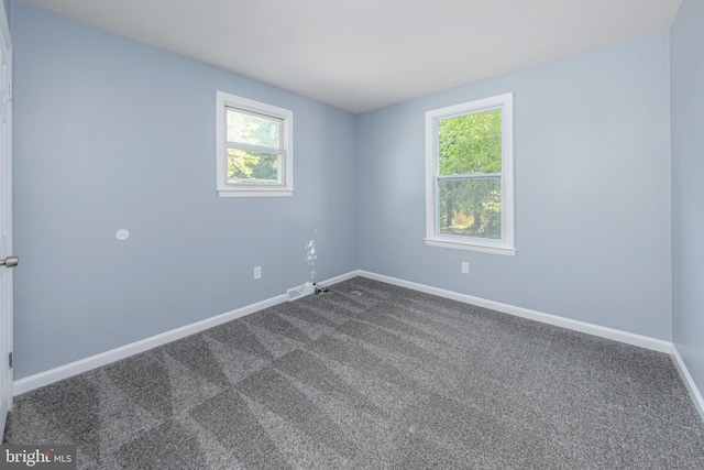 empty room with carpet flooring