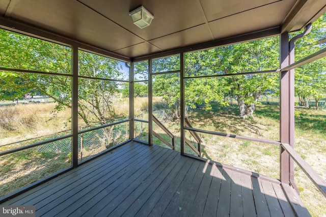 unfurnished sunroom with plenty of natural light