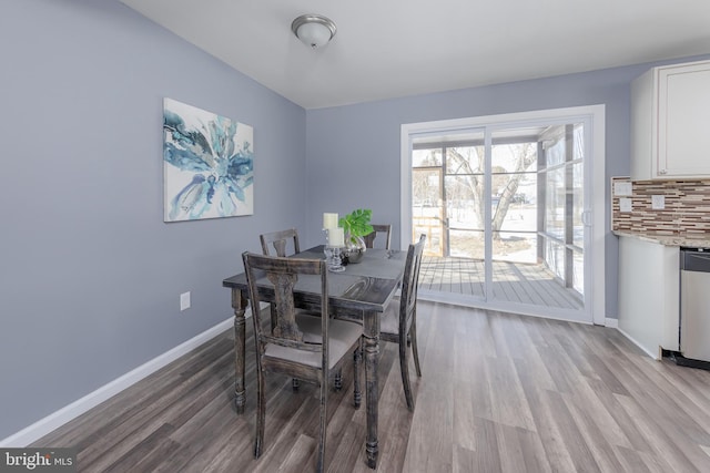 dining space featuring light hardwood / wood-style floors