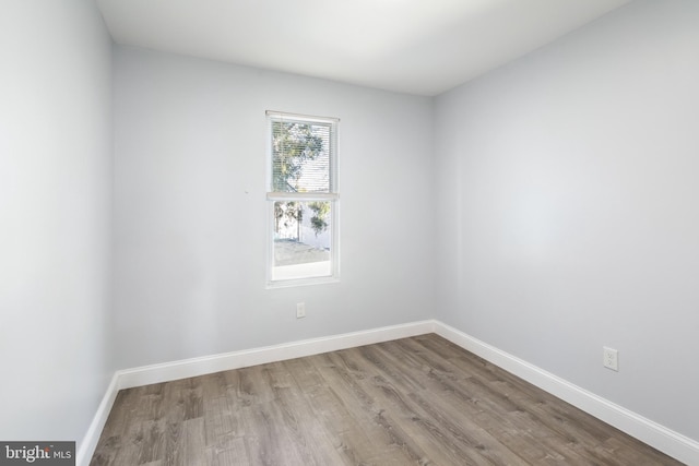 spare room with light hardwood / wood-style flooring