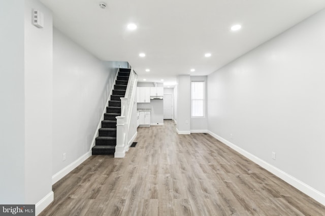 unfurnished living room featuring light hardwood / wood-style flooring