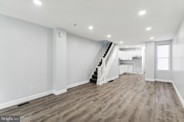 unfurnished living room with light hardwood / wood-style floors