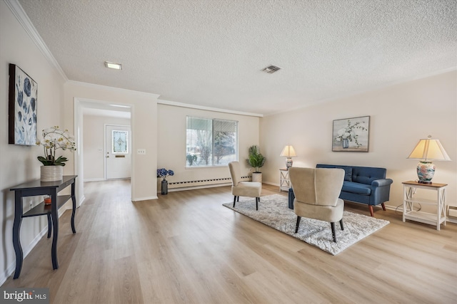 interior space with crown molding, visible vents, light wood-style flooring, baseboard heating, and a textured ceiling