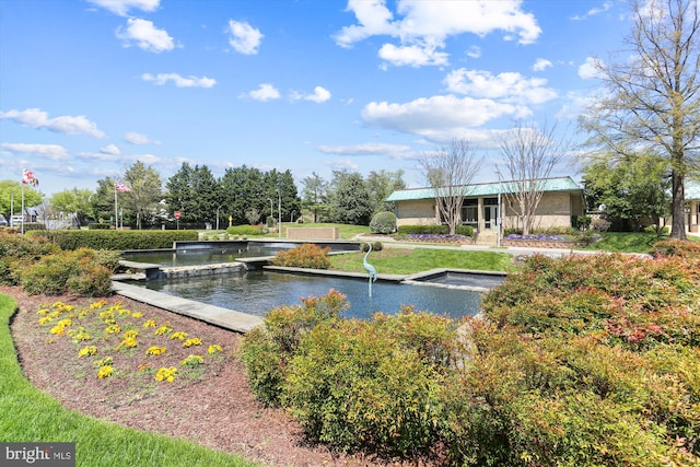 view of community with a water view