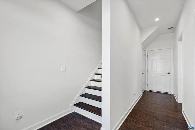 stairway featuring hardwood / wood-style floors