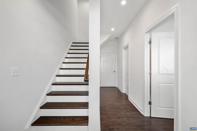 staircase with wood-type flooring