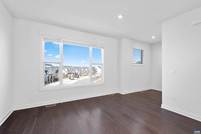 empty room featuring dark hardwood / wood-style floors