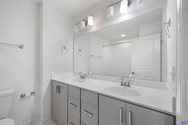 bathroom with toilet and vanity