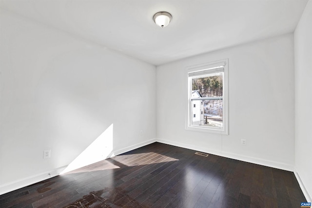 spare room featuring hardwood / wood-style floors