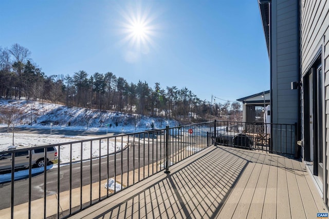 view of snow covered deck