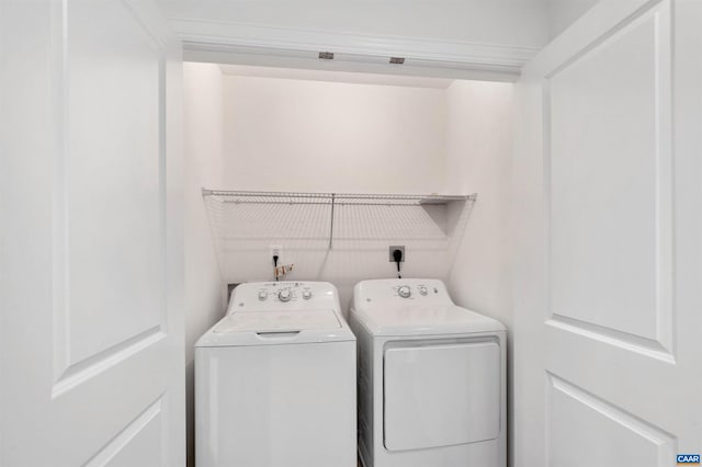 washroom featuring washing machine and dryer